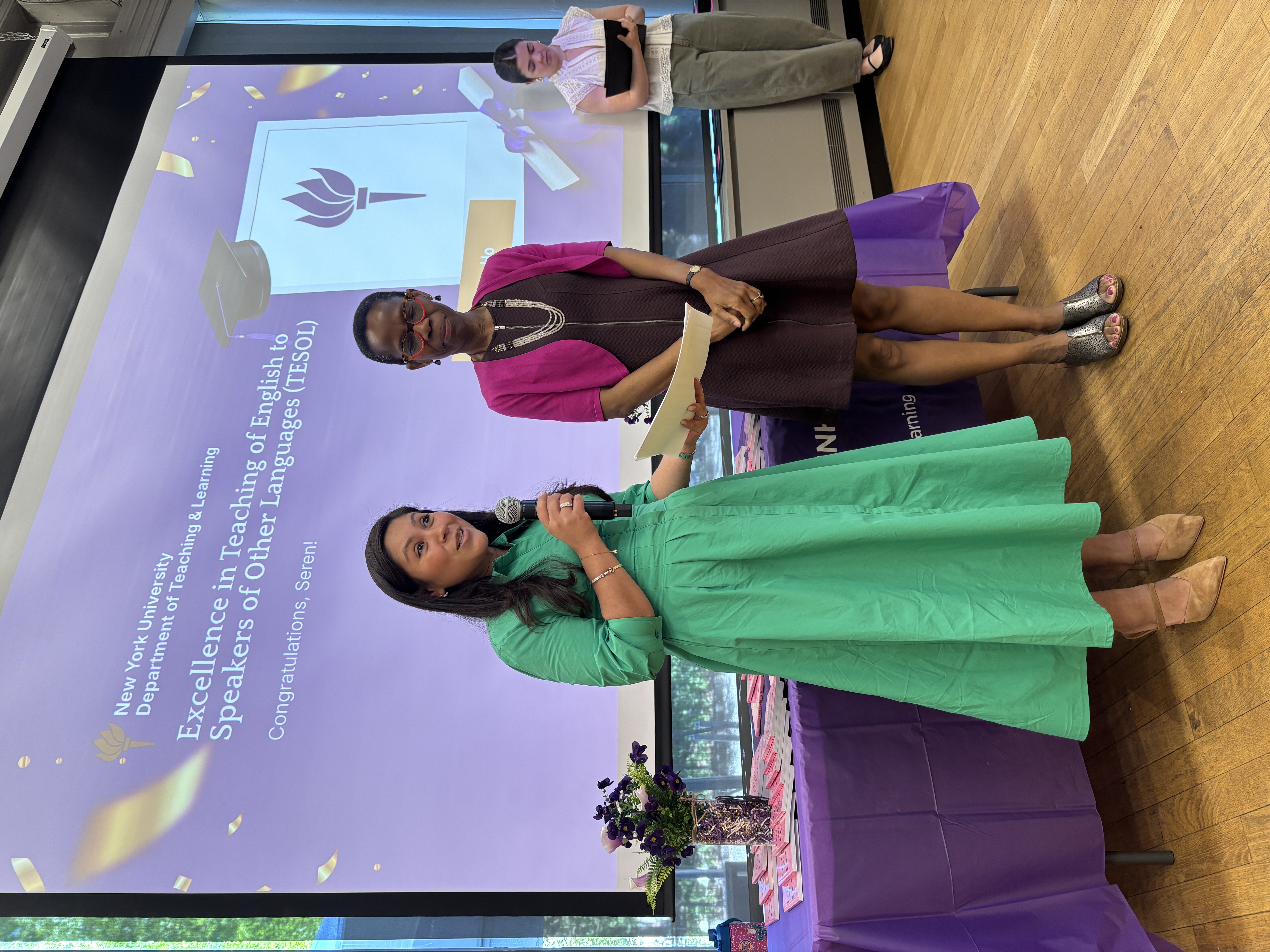 Erica and a colleague at an educational presentation